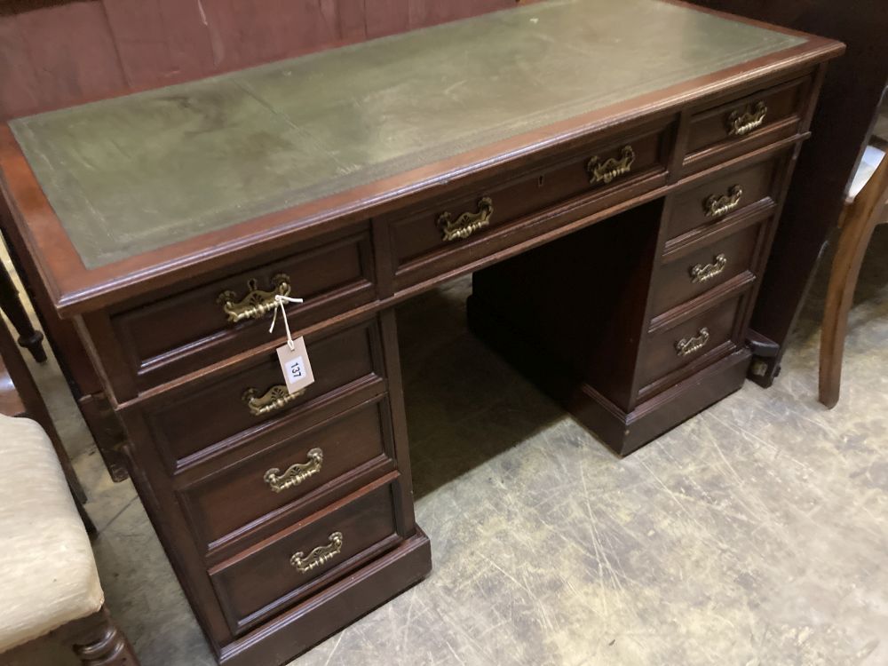 A late Victorian mahogany pedestal desk, stamped J. Shoolbred, width 122cm depth 55cm height 75cm